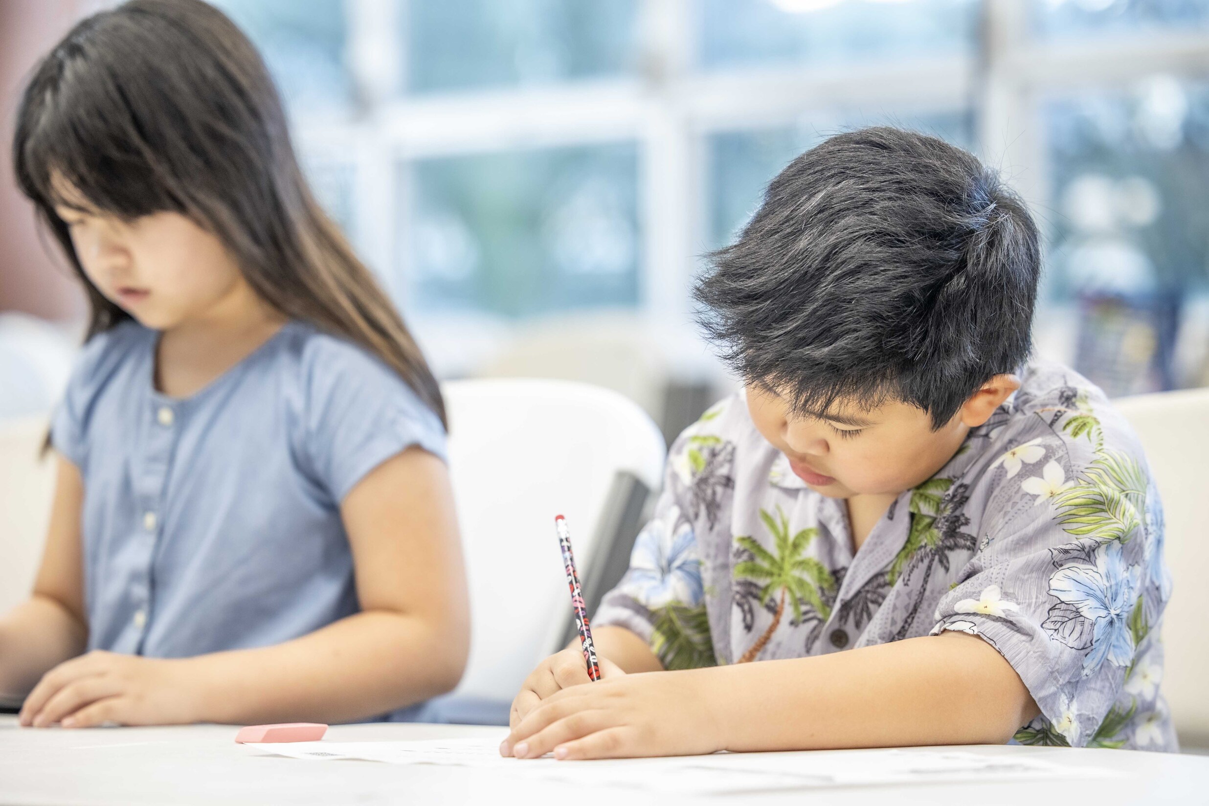 Classroom scene with elementary and middle school students learning in Japanese
